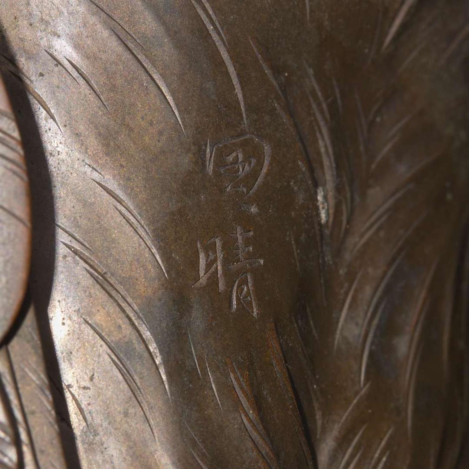 A Japanese patinated bronze figure of a preening heron, signed Kuniharu 日本鹭鸶铜塑 斉木 Meiji / Taisho ?????