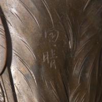 A Japanese patinated bronze figure of a preening heron, signed Kuniharu 日本鹭鸶铜塑 斉木 Meiji / Taisho ?????