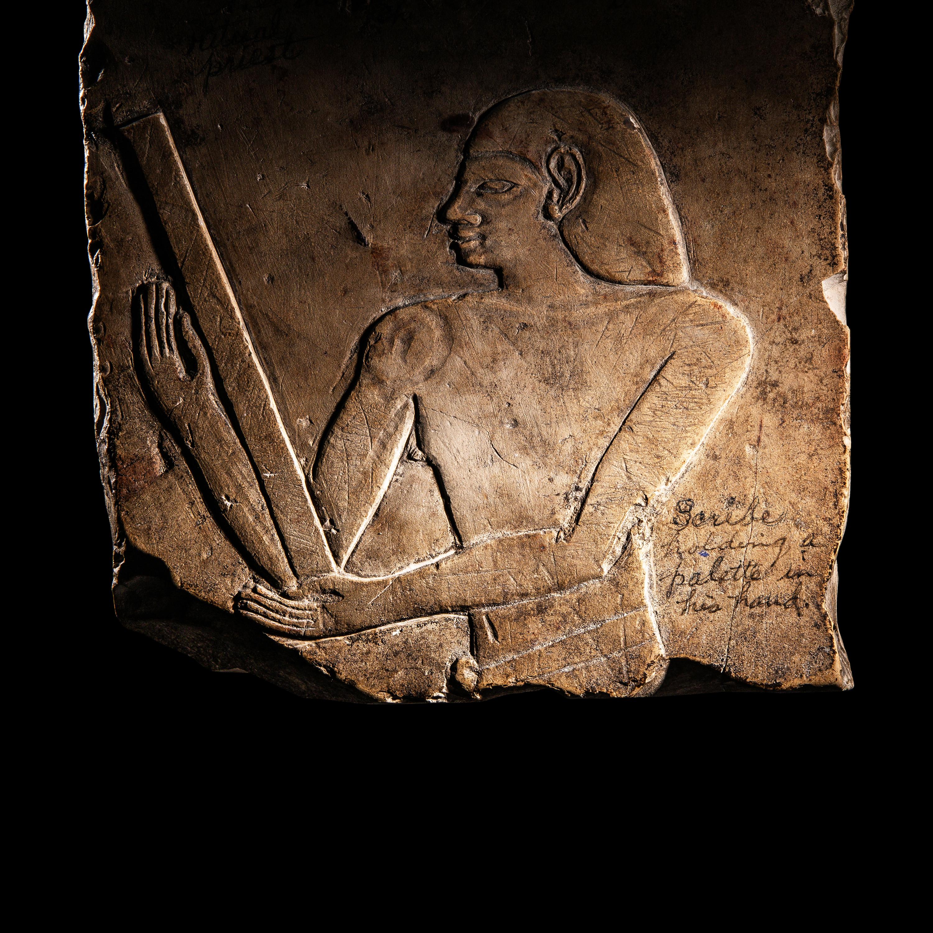 An Egyptian Limestone Relief Fragment with a Priest