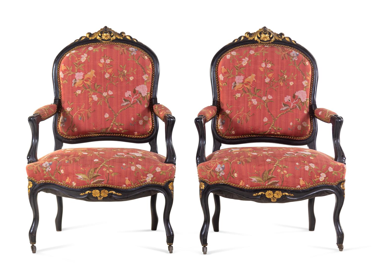 A Pair Louis XV Style Scalamandré Upholstered Parcel Gilt and Ebonized Fauteuils
