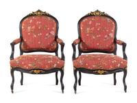 A Pair Louis XV Style Scalamandré Upholstered Parcel Gilt and Ebonized Fauteuils