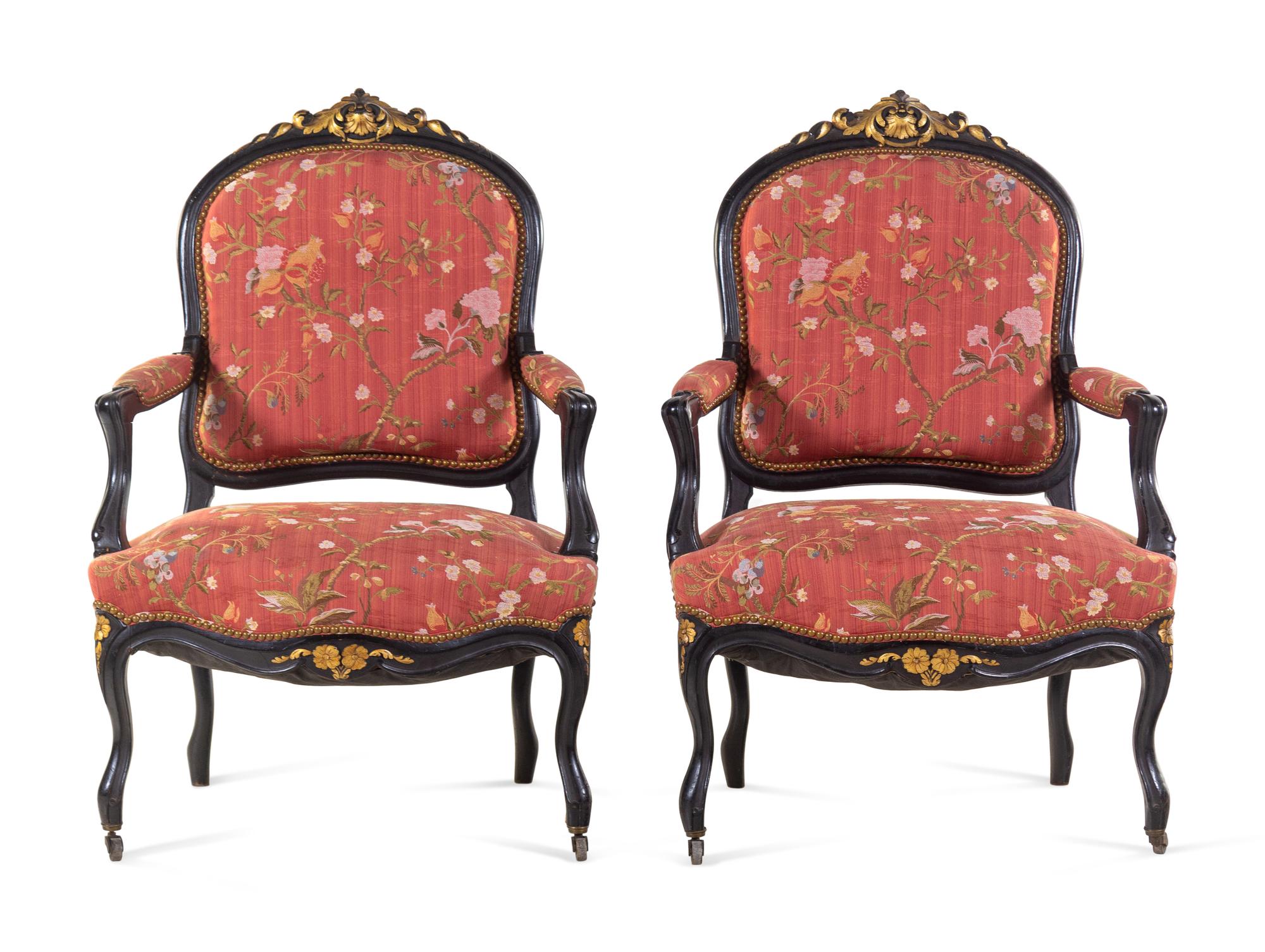 A Pair Louis XV Style Scalamandré Upholstered Parcel Gilt and Ebonized Fauteuils