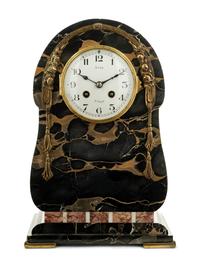 A Continental Gilt Bronze Mounted Marble Mantel Clock