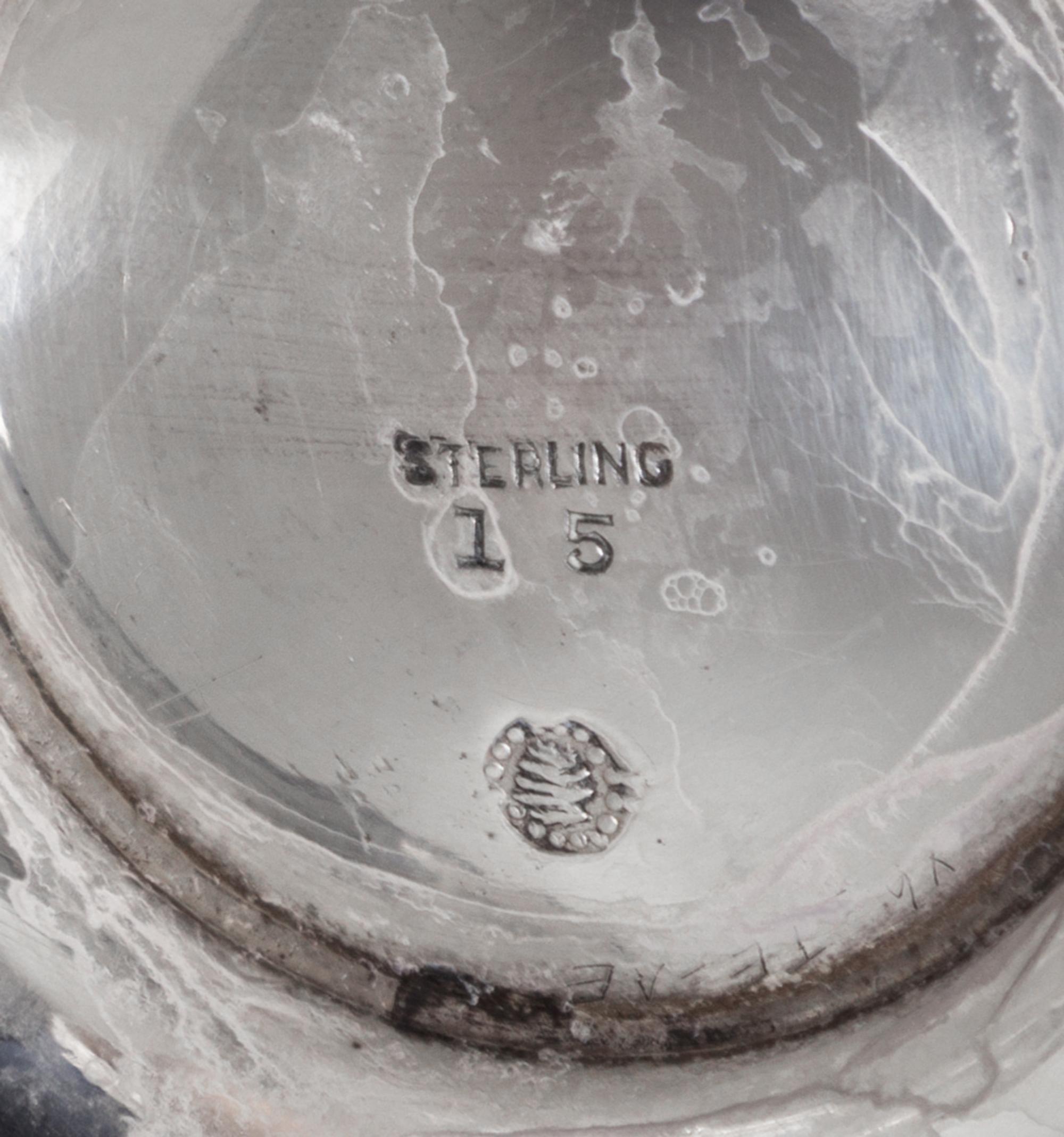 An American Silver Chocolate Pot, Tuttle Silversmiths, Boston, MA, of baluster form with a wood handle and a circular foot.