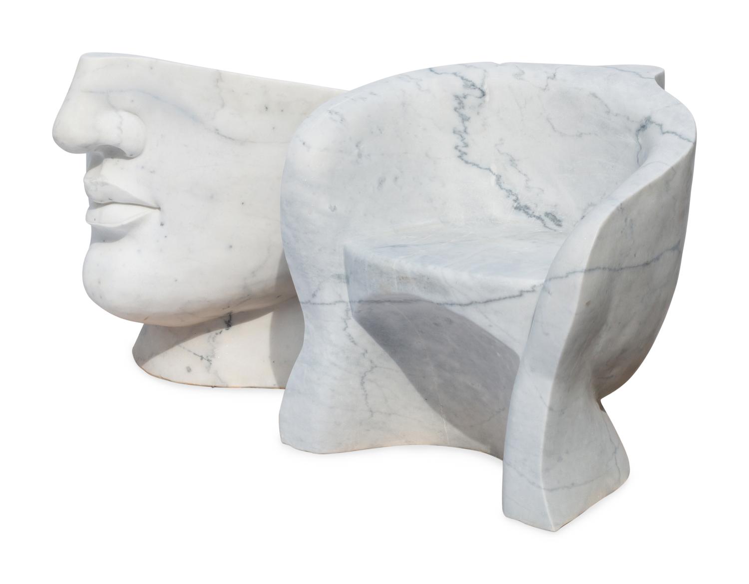A Pair of Italian Carved White Marble “Face” Chairs