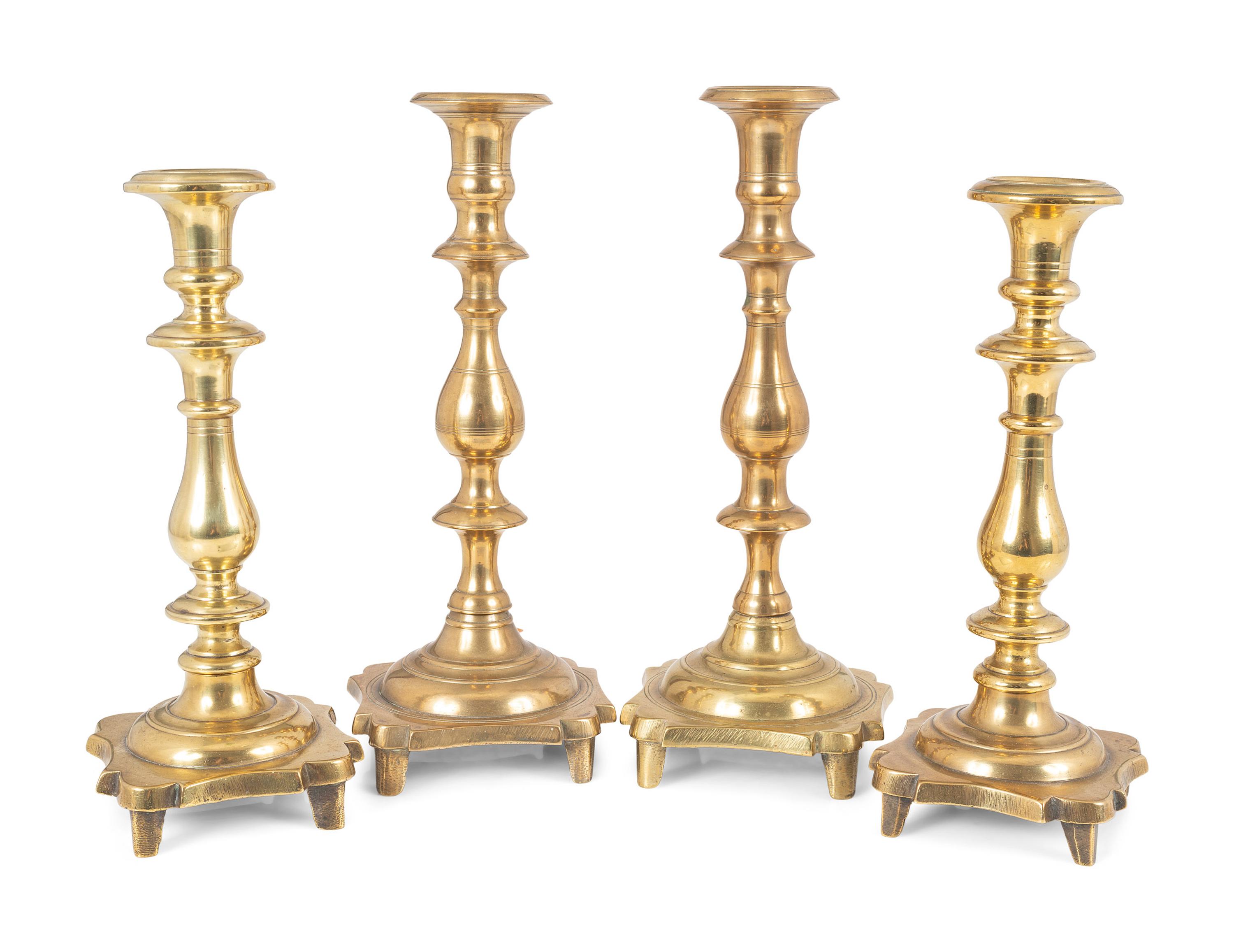 Two Pairs of English Brass Footed Base Candlesticks