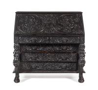 A Renaissance Revival Carved Slant-Front Desk