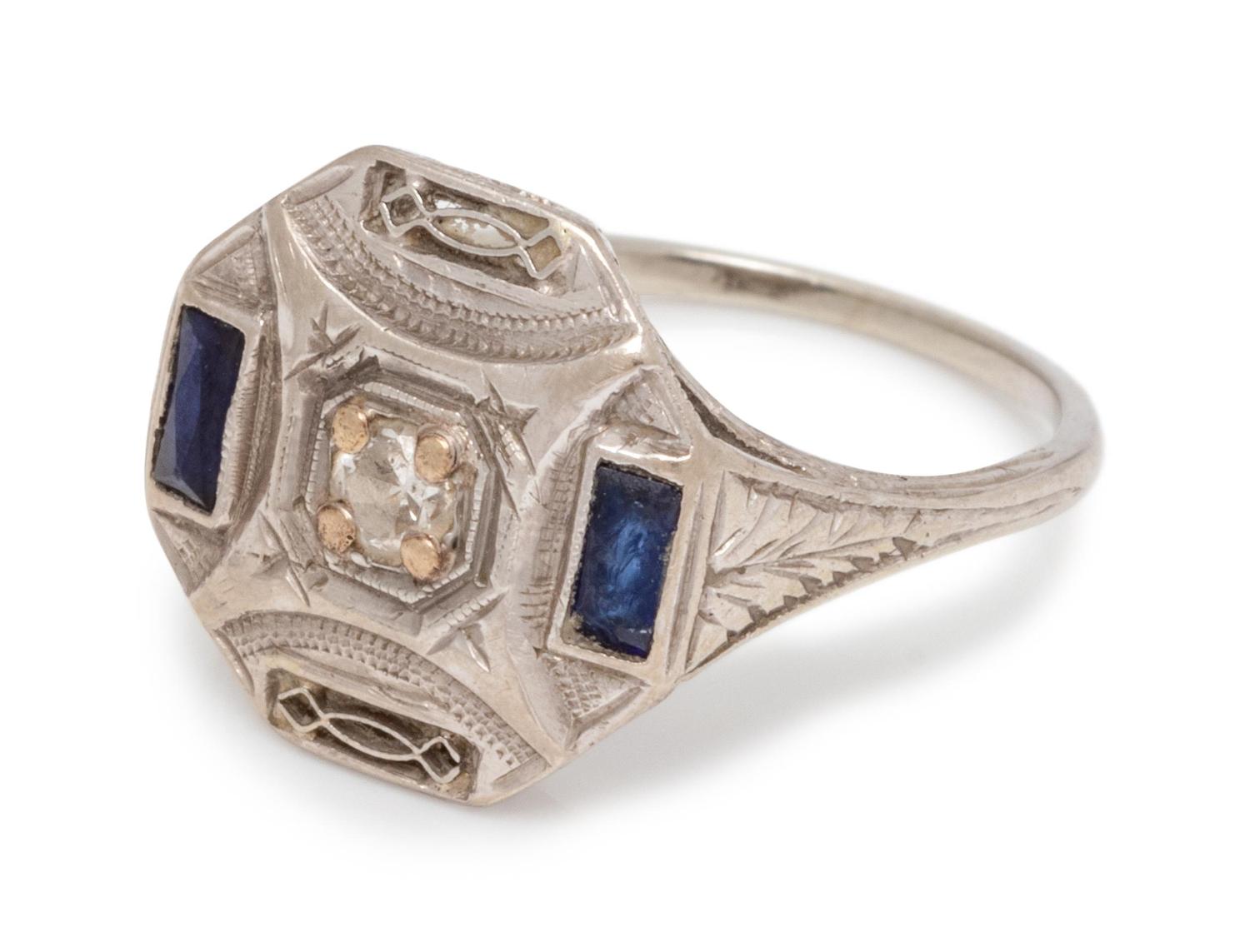 An 18 Karat White Gold, Diamond and Synthetic Sapphire Ring,