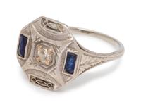 An 18 Karat White Gold, Diamond and Synthetic Sapphire Ring,