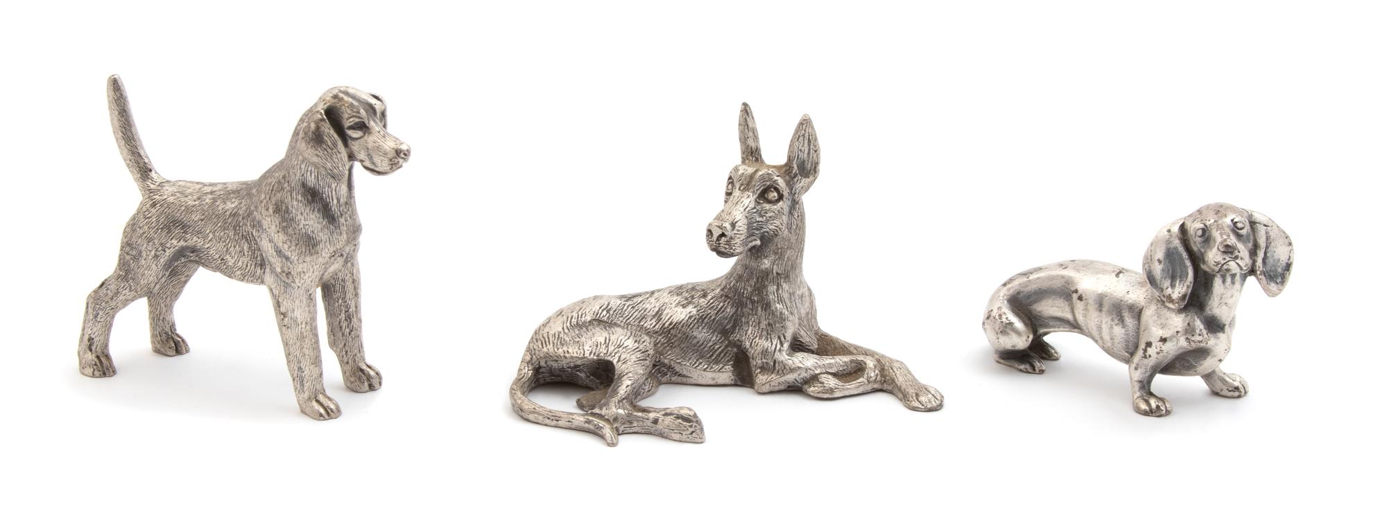 A Group of Three Pewter Dogs — 20TH CENTURY