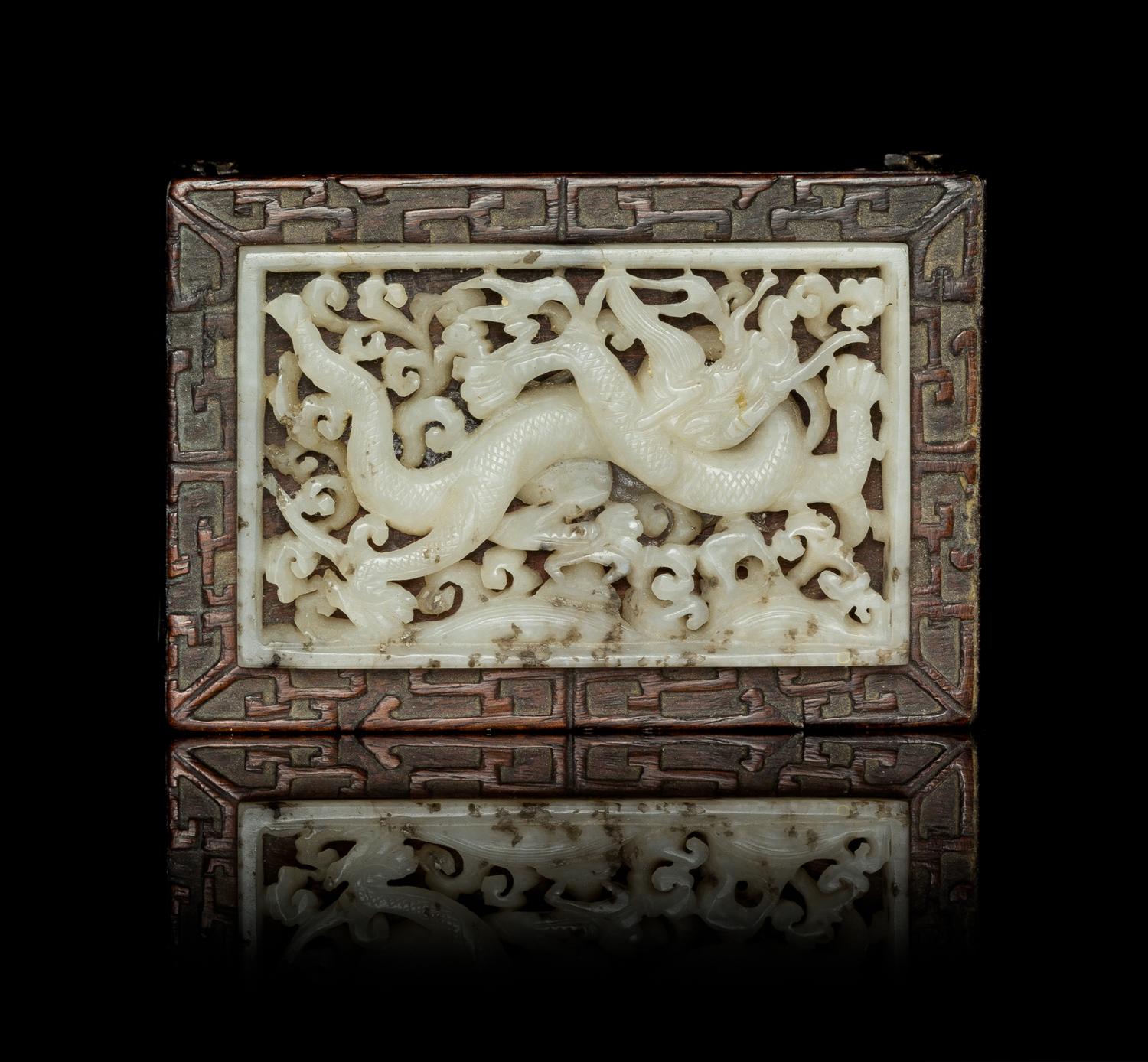 A White Jade Inset Hardwood Ink Rest Length 2 3/4 x width 1 3/4 inches.