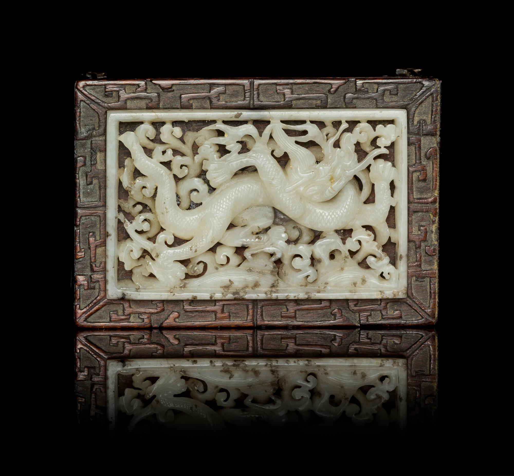 A White Jade Inset Hardwood Ink Rest Length 2 3/4 x width 1 3/4 inches.