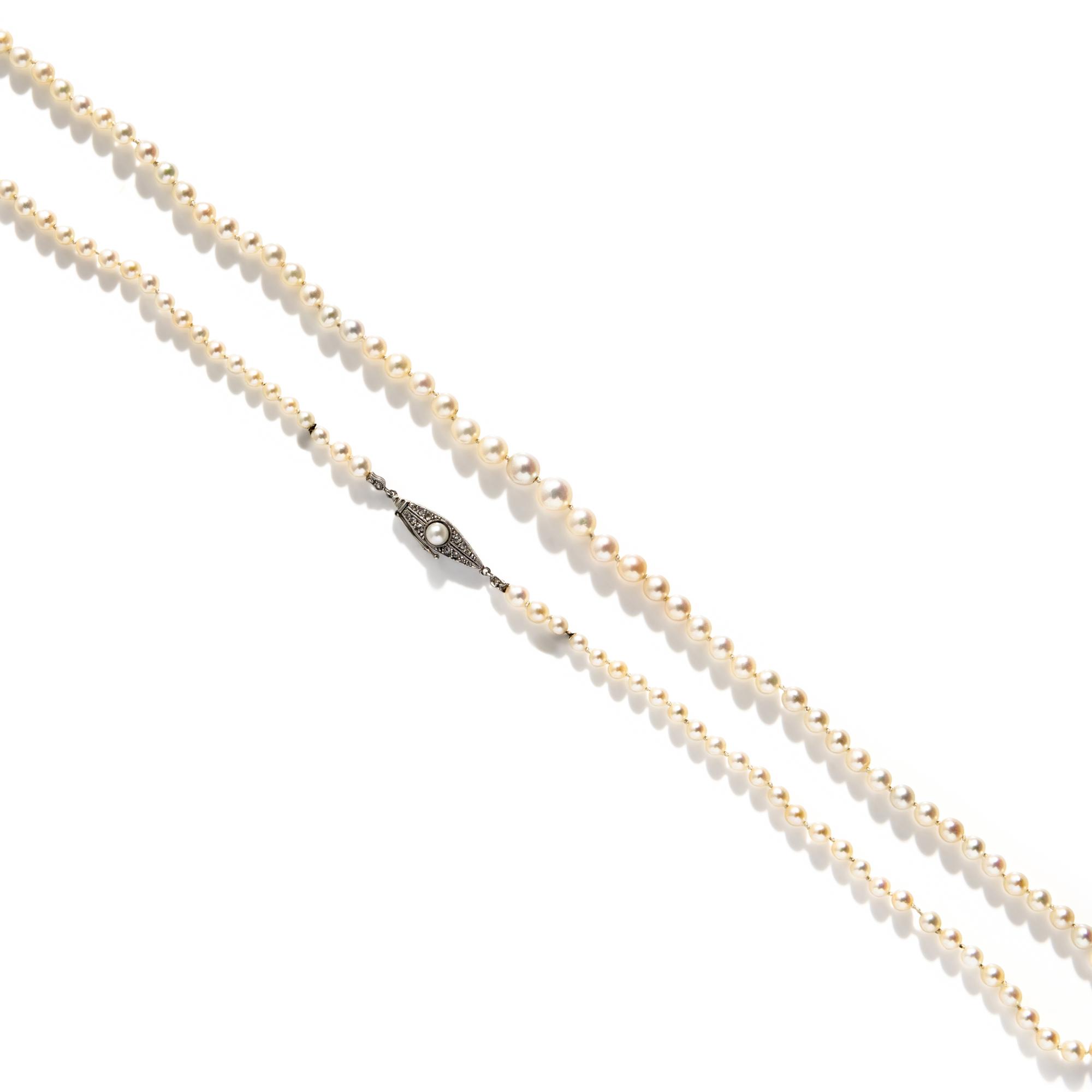 CULTURED PEARL STRAND WITH PLATINUM AND DIAMOND CLASP