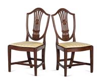 A Pair of Federal Carved and Inlaid Shield-Back Serpentine Front Side Chairs