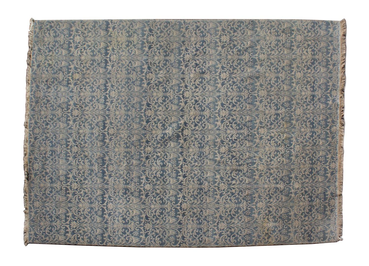 A Contemporary Blue and White Design Wool Rug — 20TH CENTURY