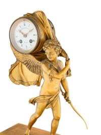 An Empire Style Gilt Bronze and Marble Figural Clock