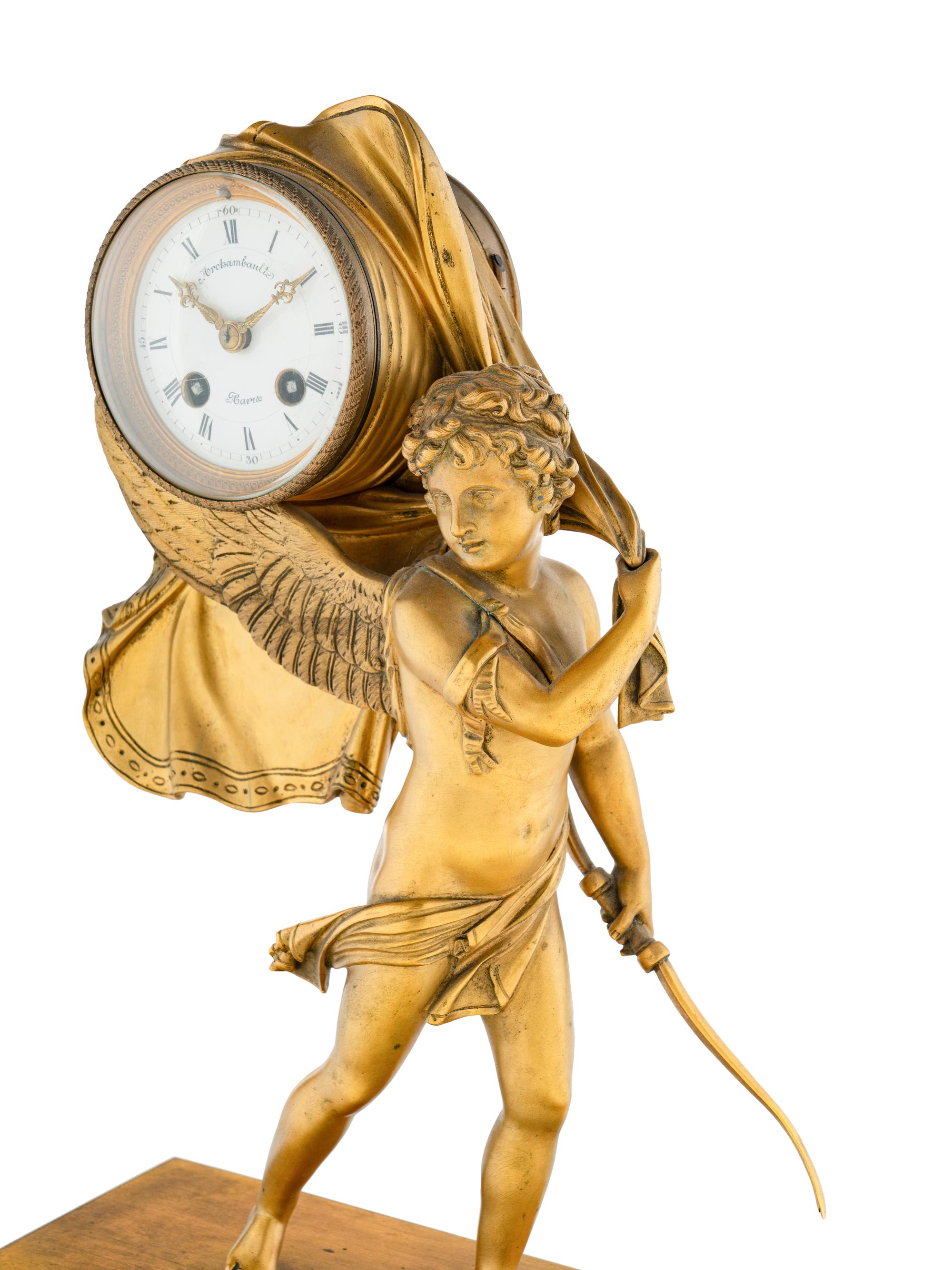 An Empire Style Gilt Bronze and Marble Figural Clock