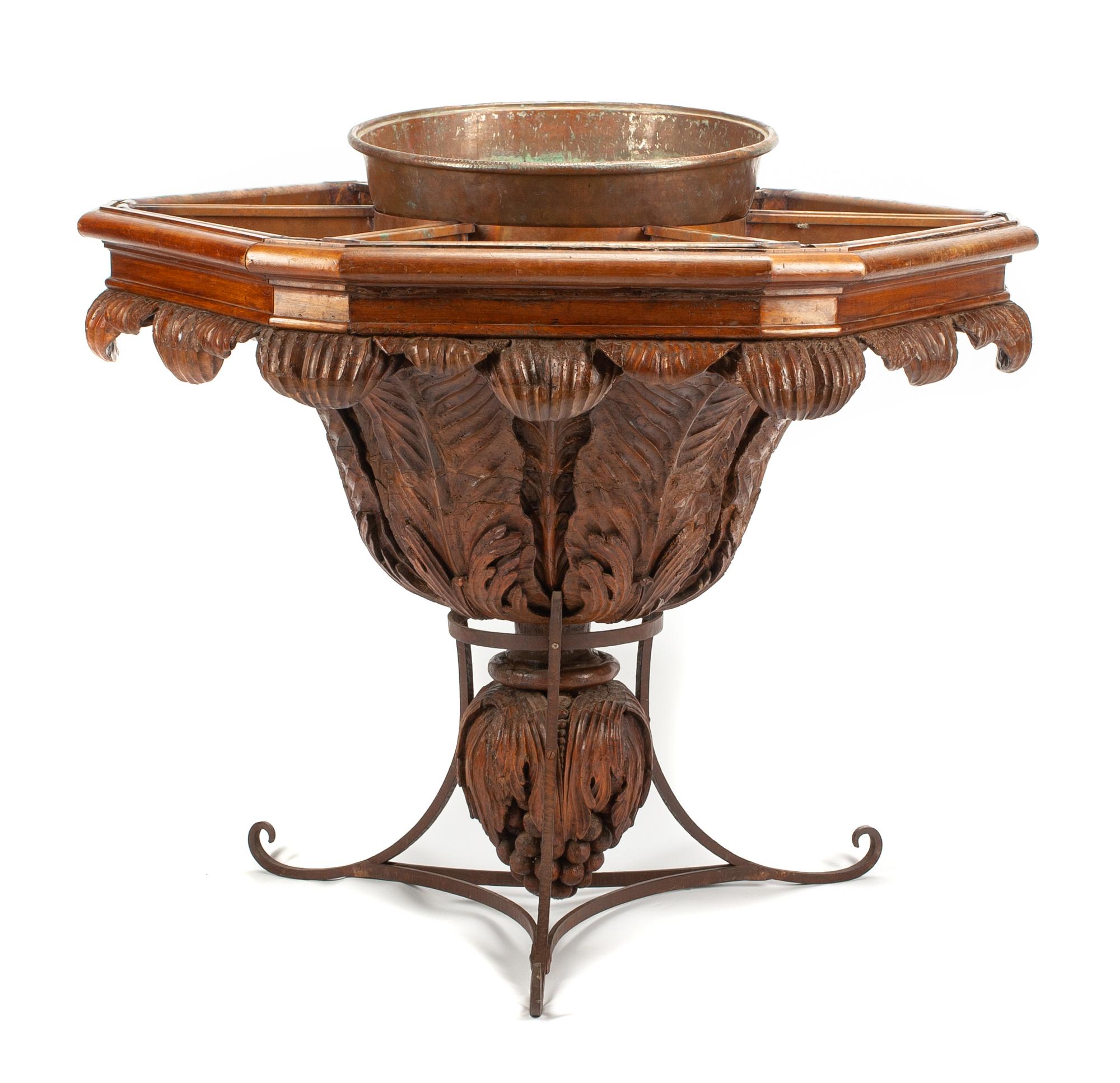 A Continental Carved Walnut and Wrought Iron Hexagonal Jardiniere Table Height 40 x width 43 inches. — 19TH CENTURY
