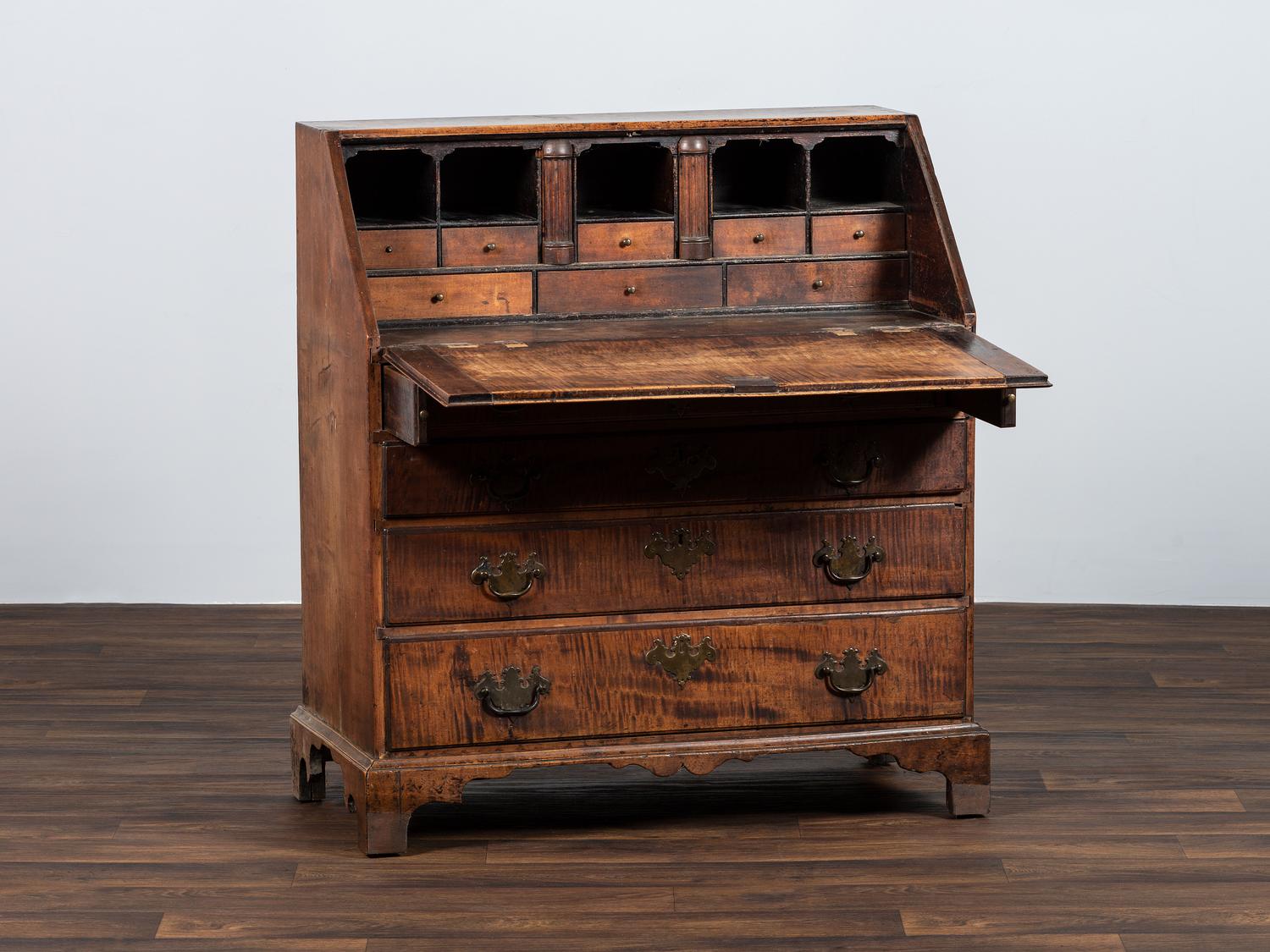 A Chippendale Carved Tiger Maple Slant-Front Desk