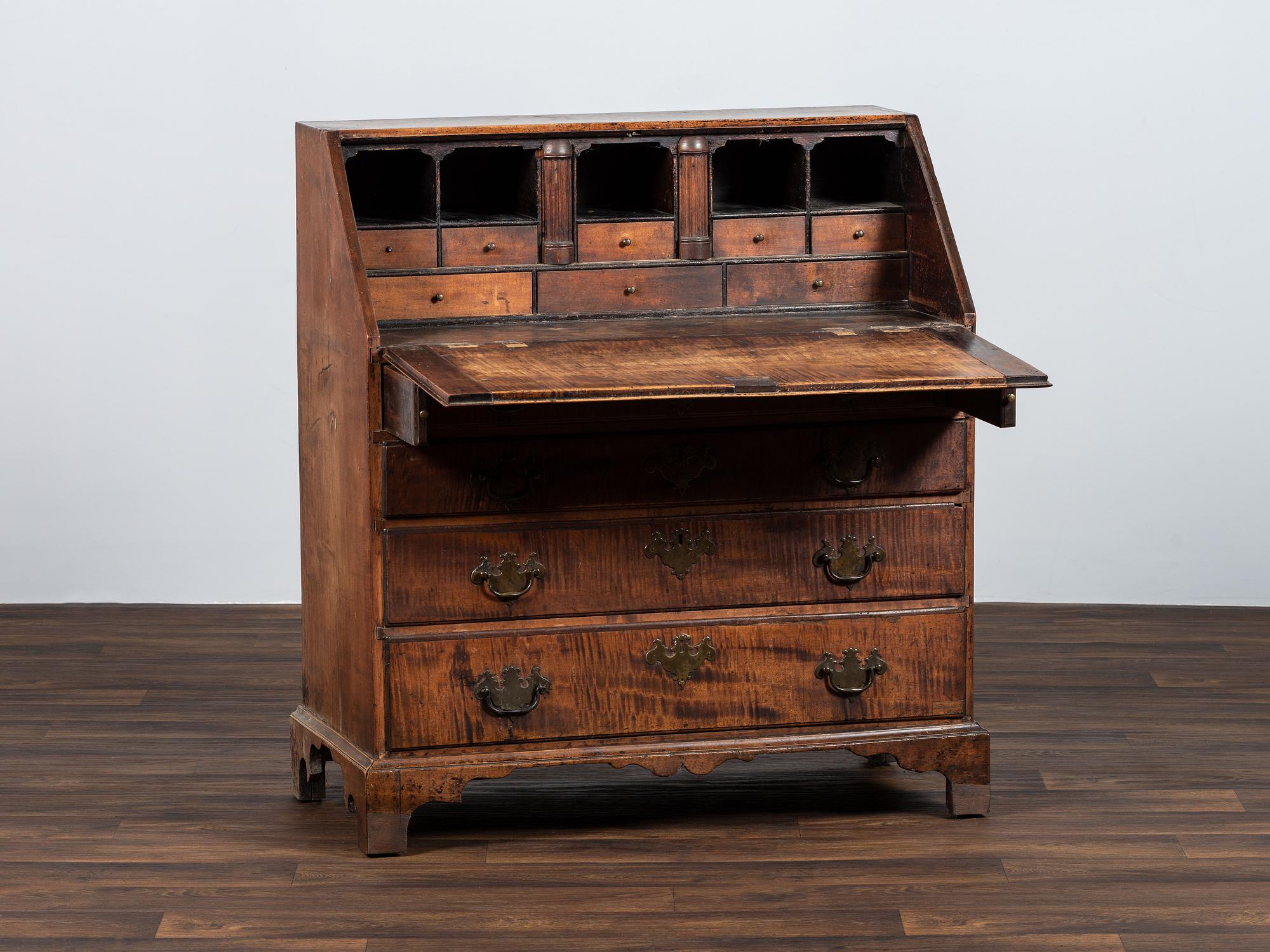 A Chippendale Carved Tiger Maple Slant-Front Desk