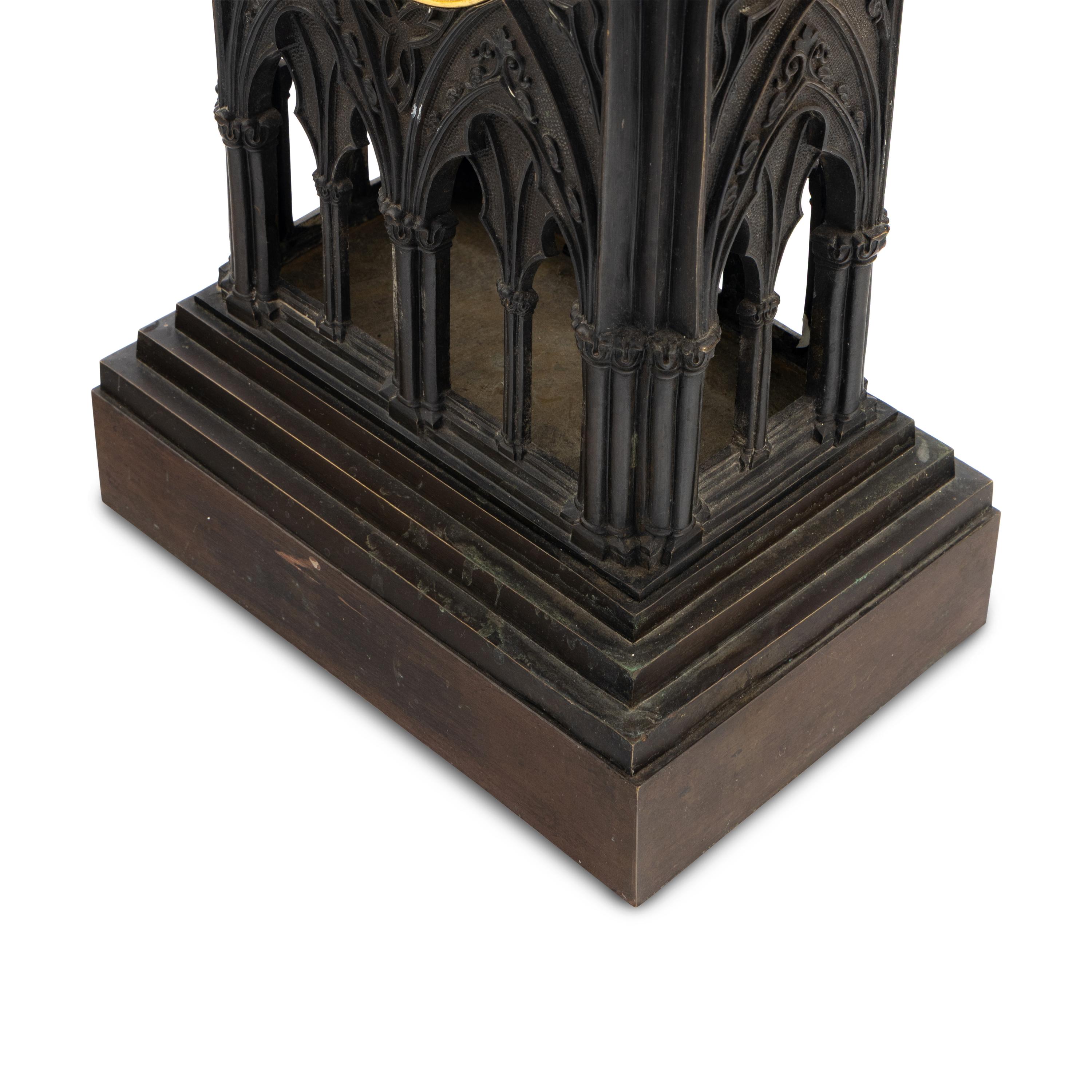 A French Patinated and Parcel Gilt Bronze Cathedral-Form Clock