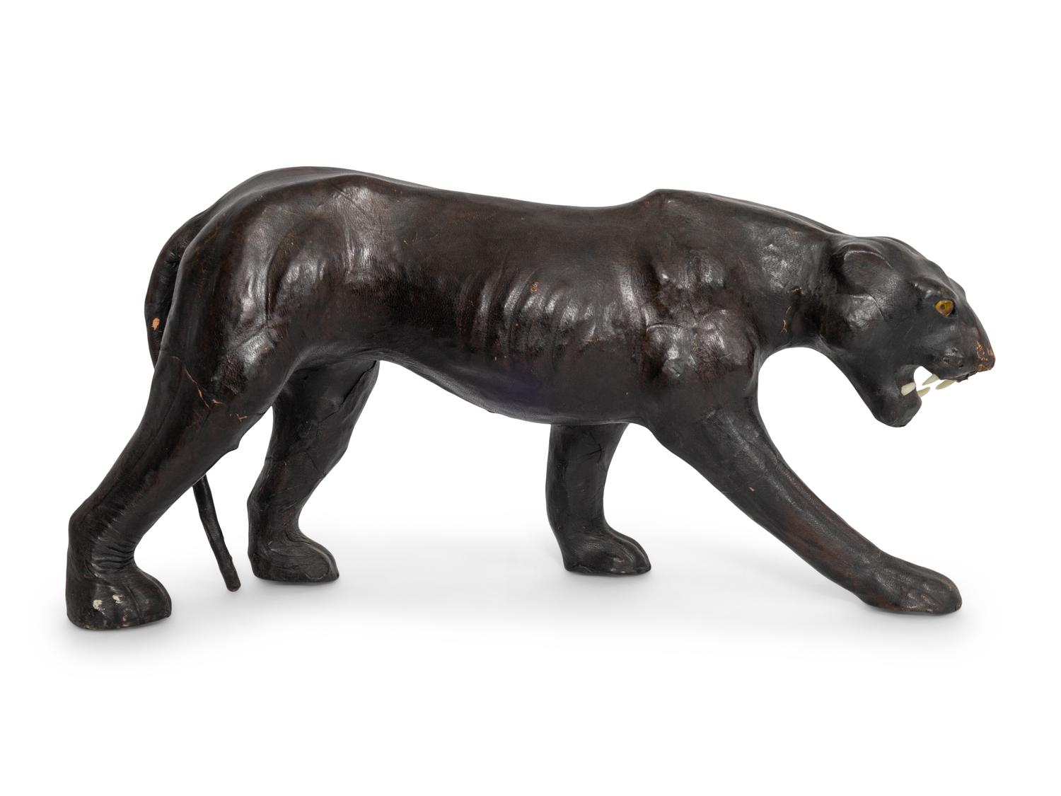 Two Leather Clad Animal Figures