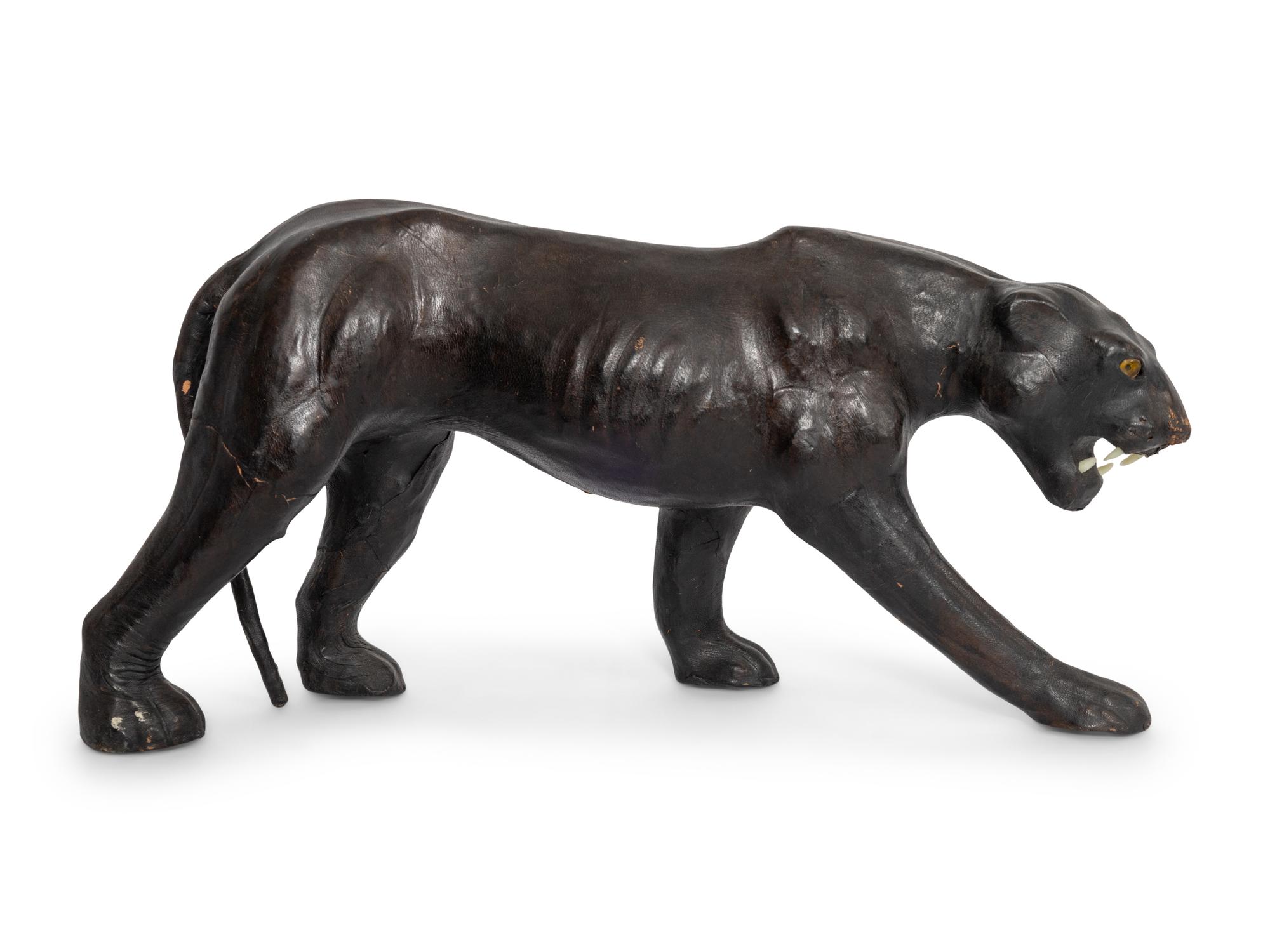 Two Leather Clad Animal Figures