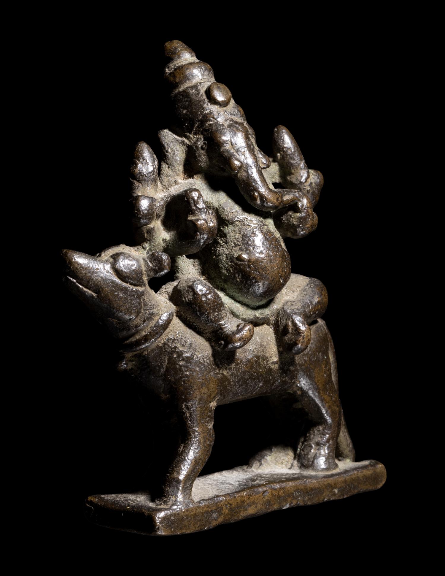 An Indian Bronze Figure of Ganesha Mounted