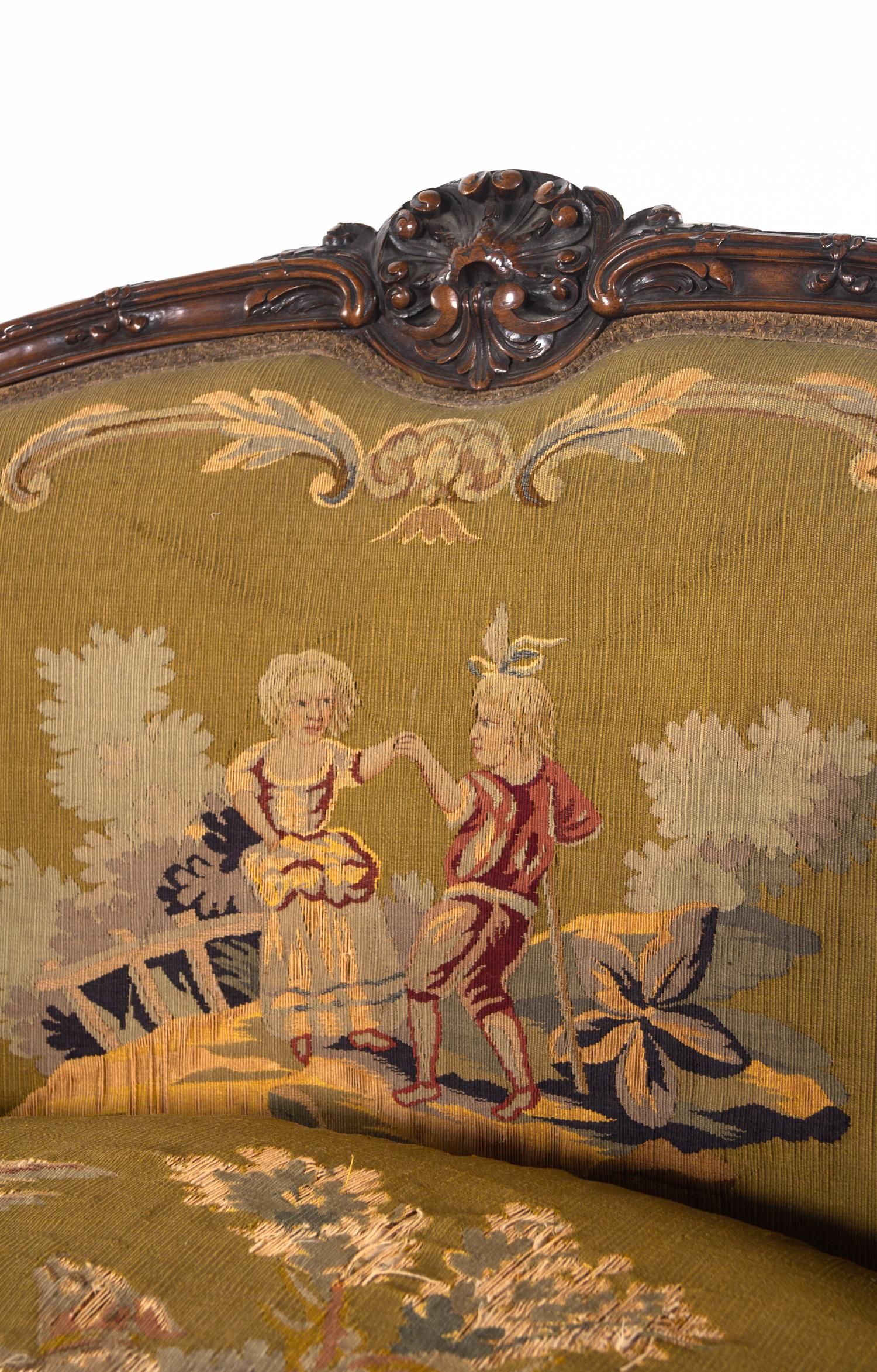 A Louis XV Style Carved Walnut Settee with Tapestry Upholstery