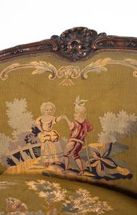 A Louis XV Style Carved Walnut Settee with Tapestry Upholstery