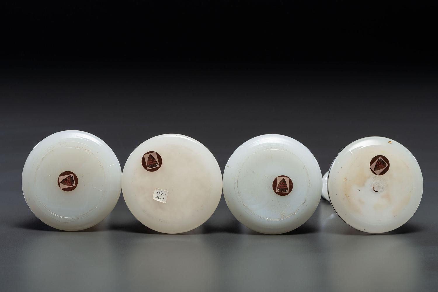 Four Milk Glass Barber Bottles with Ceramic Stoppers