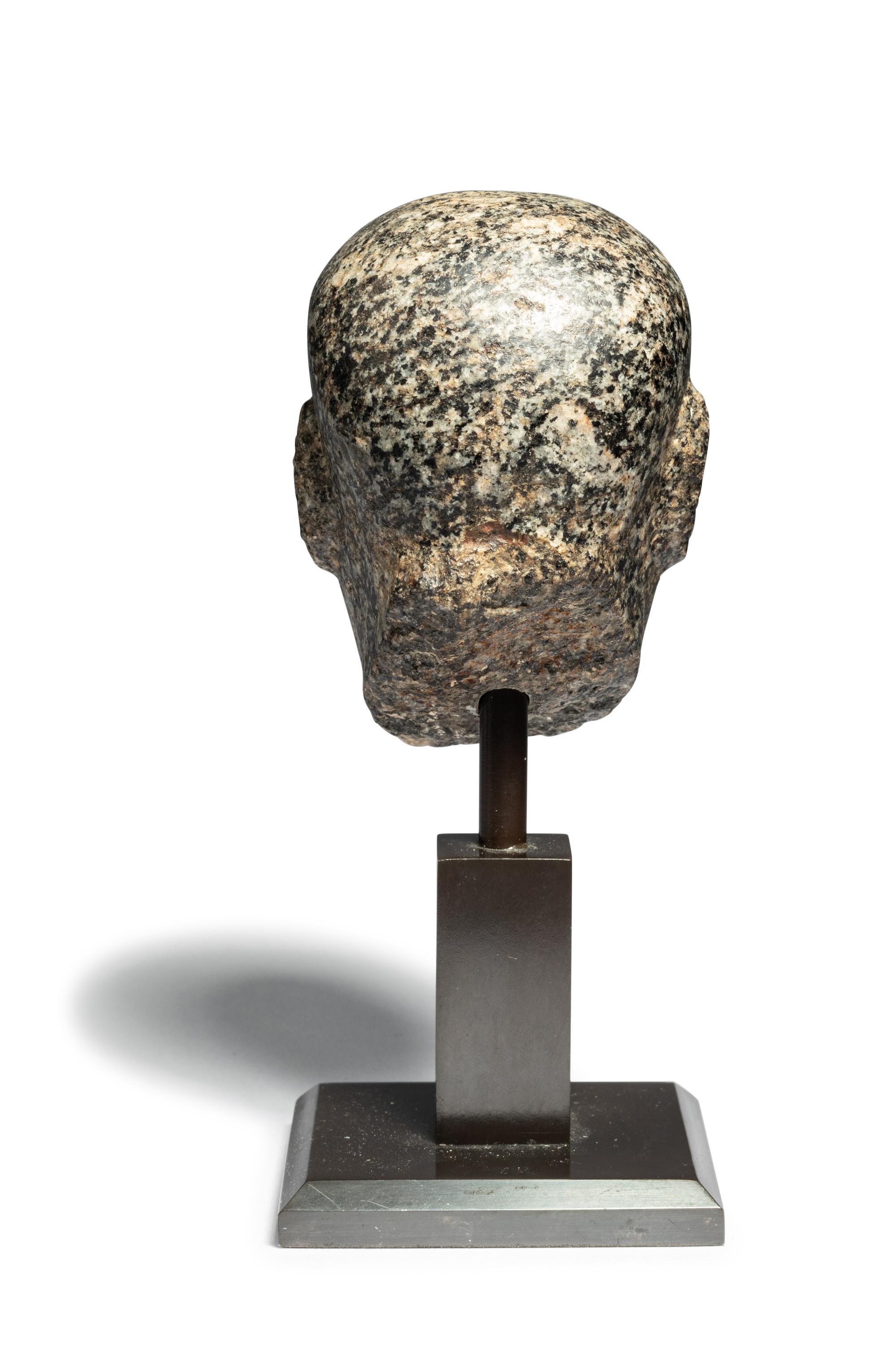 An Egyptian Stone Head of a Priest