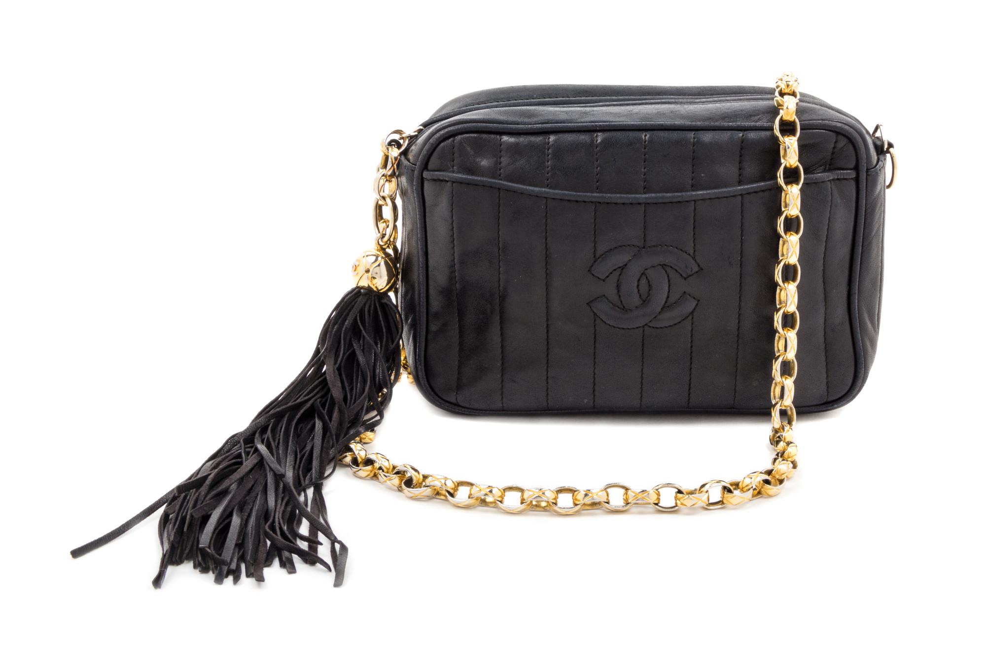 A Chanel Black Leather Handbag, 8.5" x 5".