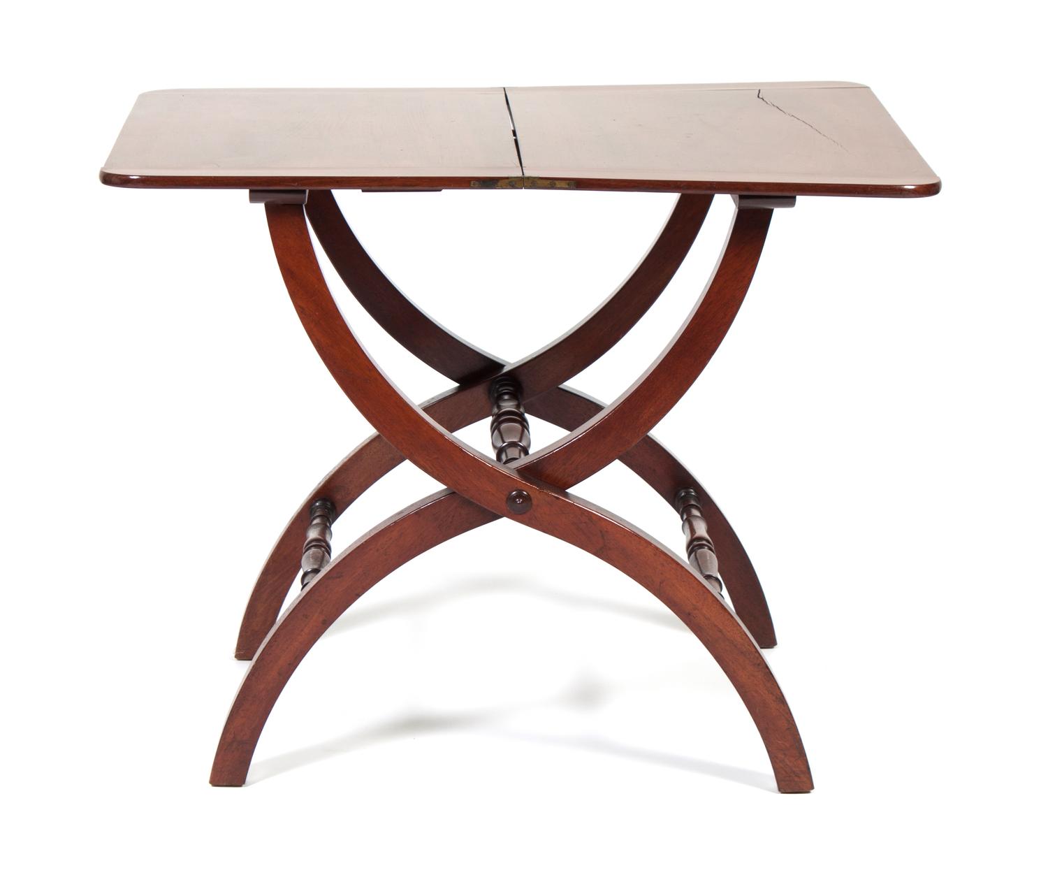 An English Mahogany Folding Utility Table Height 28 1/4 x width 35 1/2 x depth 26 inches.