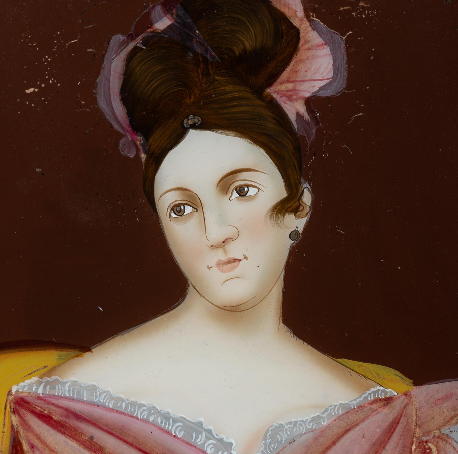 A Chinese Export Reverse Painted Glass Portrait of a Young Lady