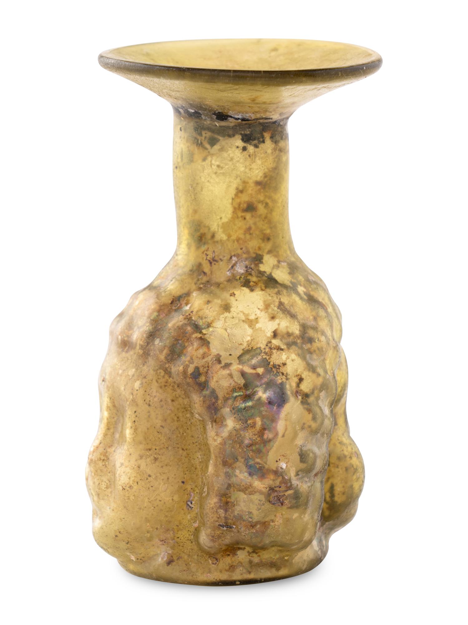 A Roman Glass Janus Head Flask