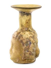 A Roman Glass Janus Head Flask