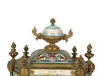 A French Porcelain, Gilt Bronze and Champlevé Clock — CIRCA 1900