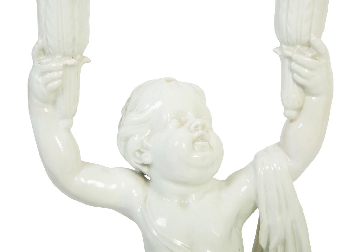 A Pair of Italian Creamware Figural Candelabra