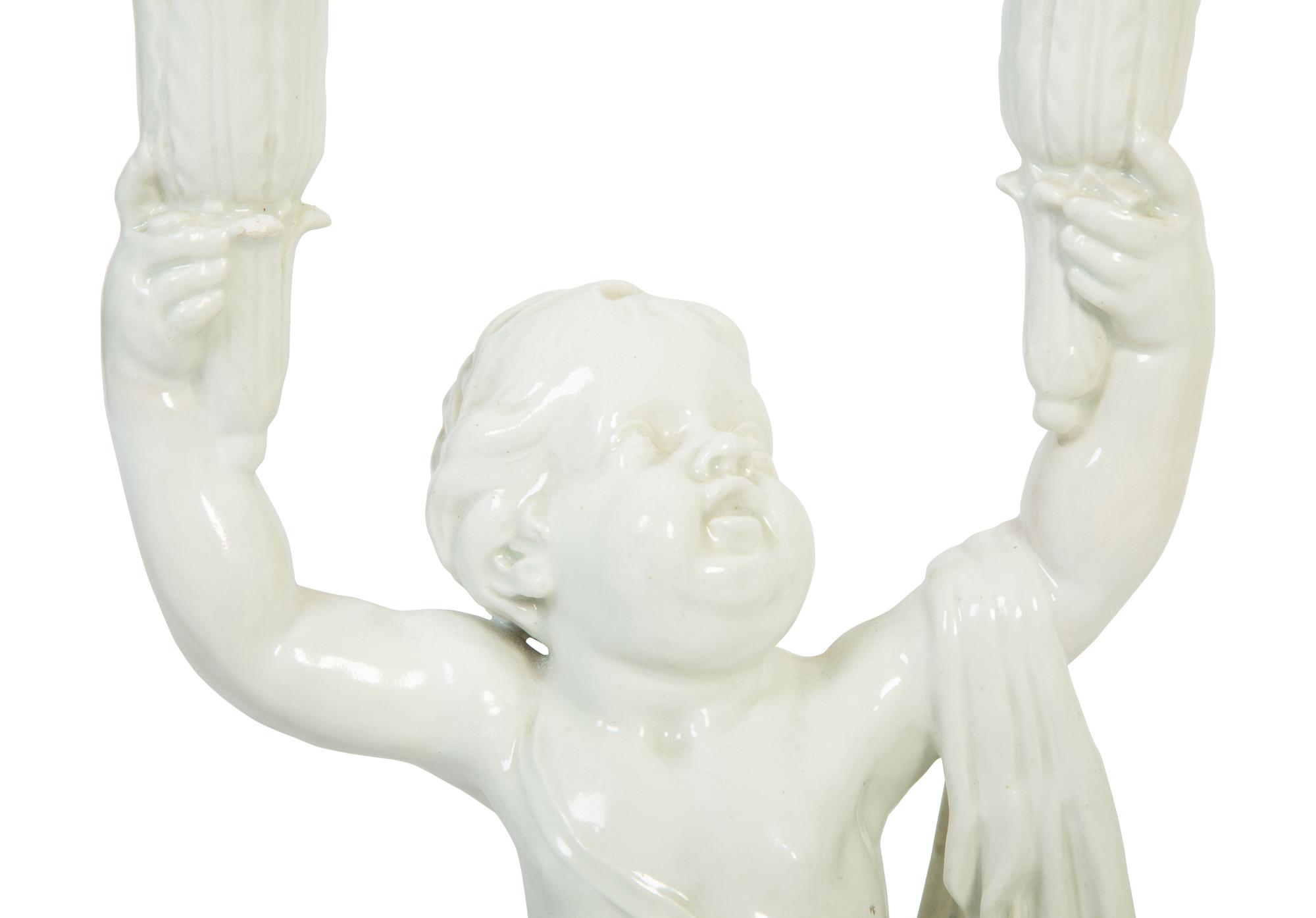 A Pair of Italian Creamware Figural Candelabra
