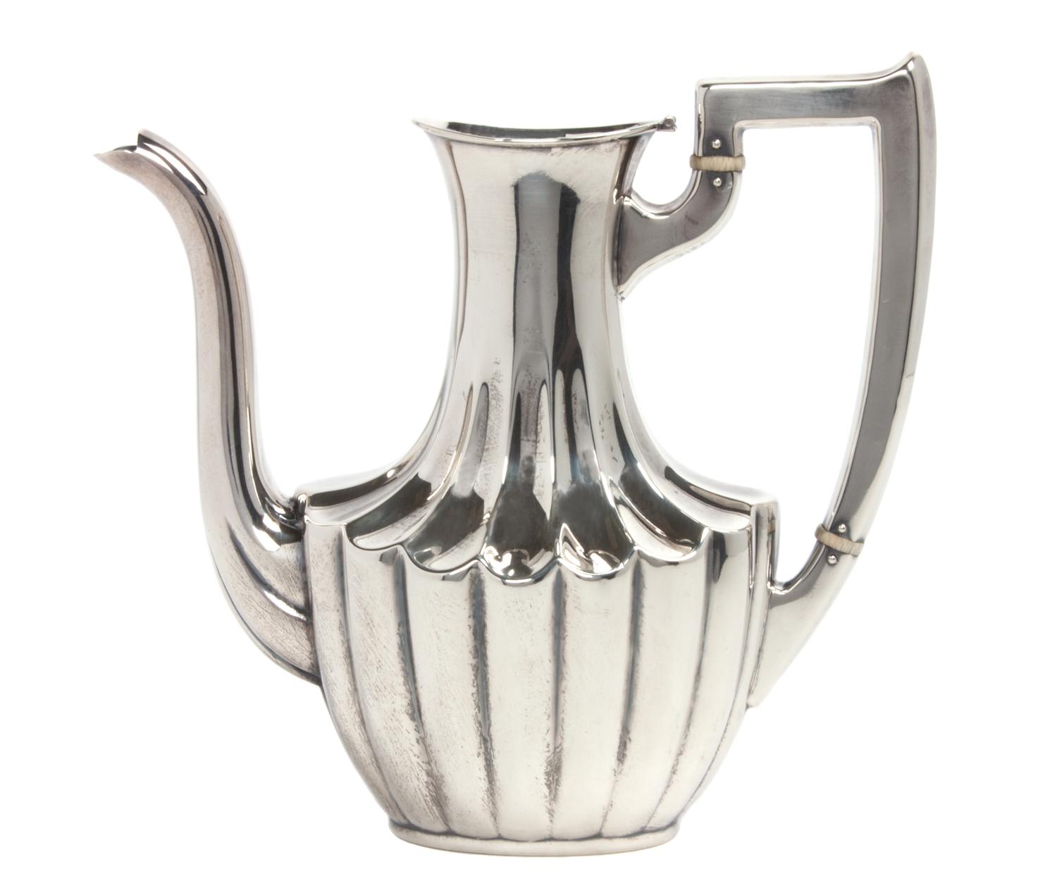 An American Silver Teapot, Mauser Manufacturing Co., New York, NY, Circa 1900, of handled form, numbered 1752.