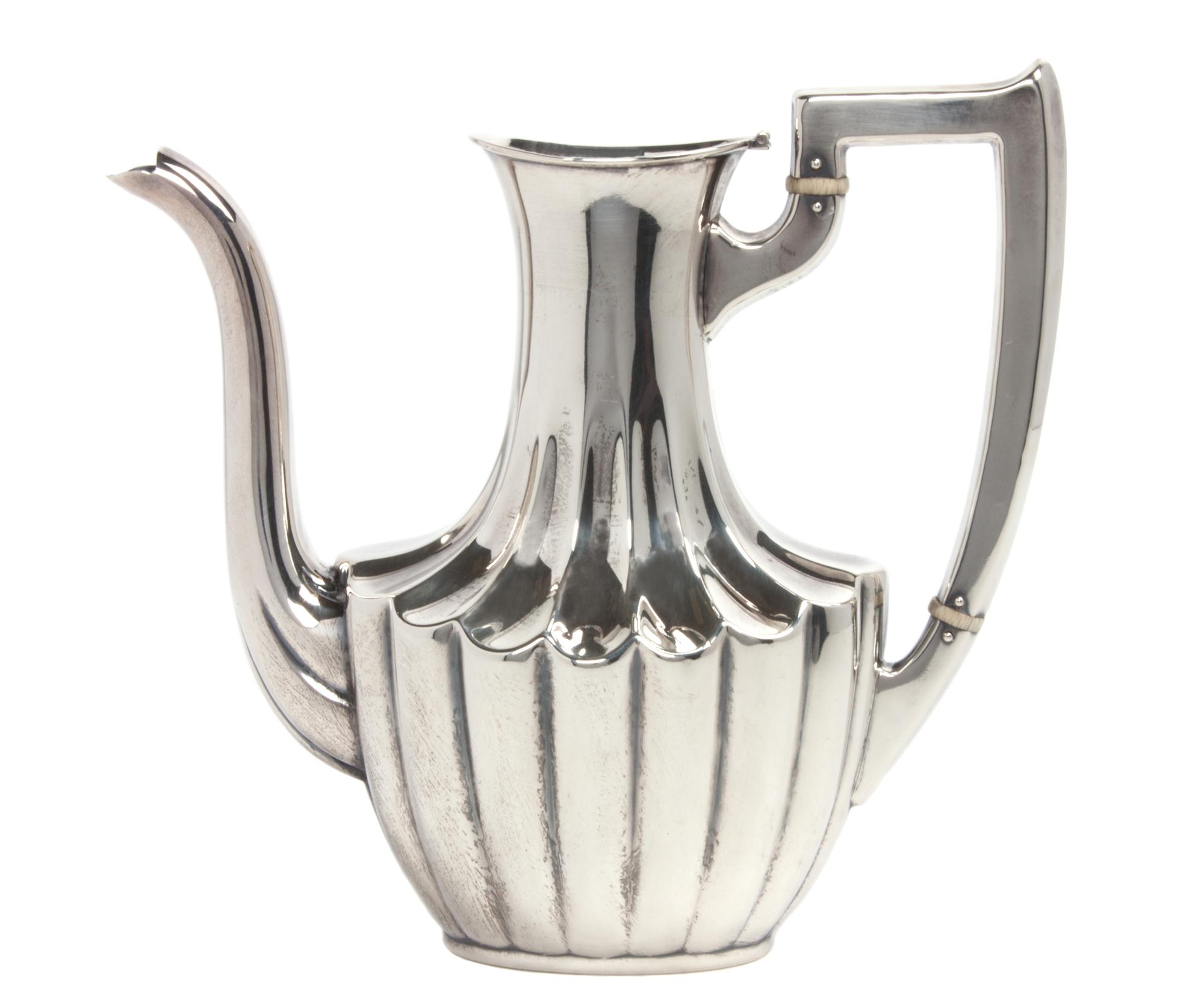 An American Silver Teapot, Mauser Manufacturing Co., New York, NY, Circa 1900, of handled form, numbered 1752.