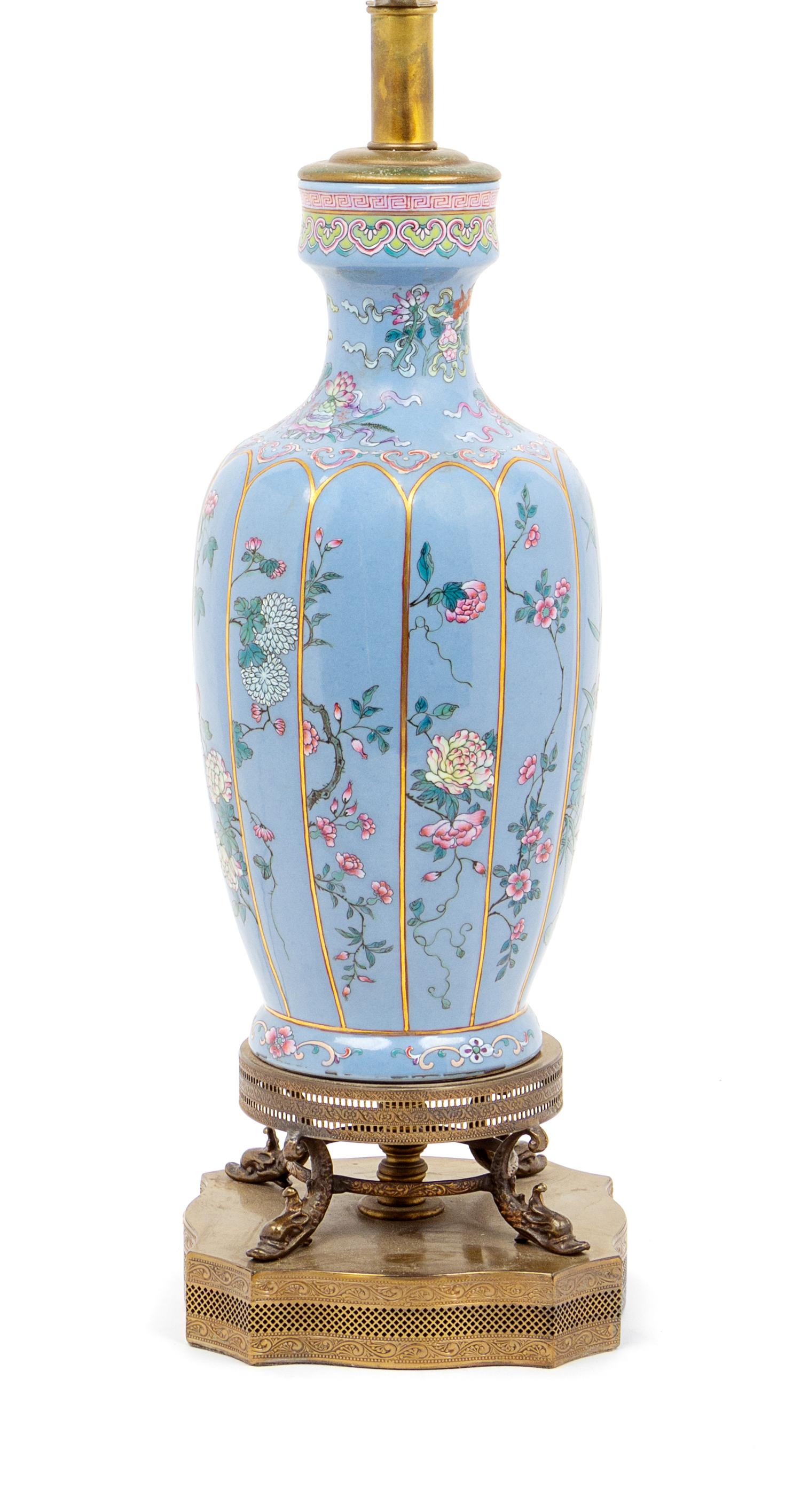 A Blue Ground Famille Rose Porcelain Vase Height of vase 12 1/4 inches. — 20TH CENTURY