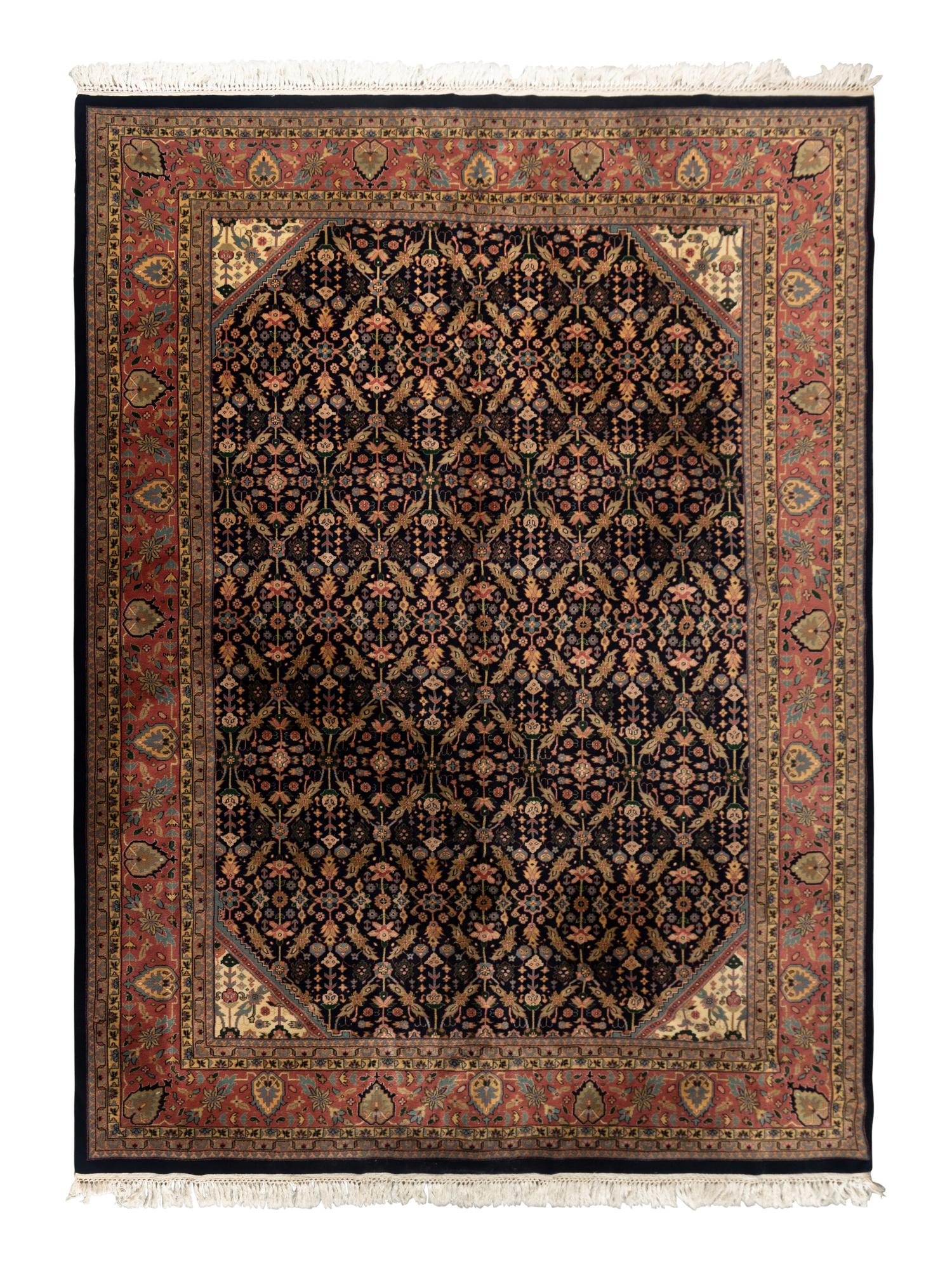 An Indo Tabriz Wool Rug