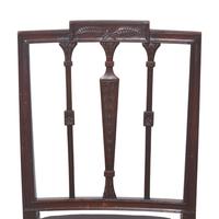 An Assembled Group of Six Federal Carved Mahogany Urn-Back and Serpentine Seat Dining Chairs