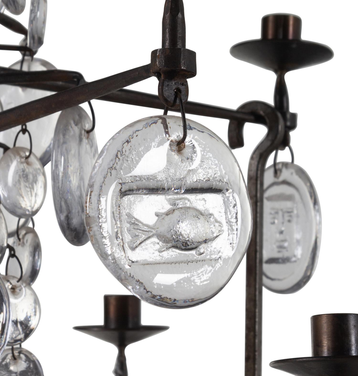 A Swedish Wrought Iron and Molded Glass Twelve-Light Chandelier