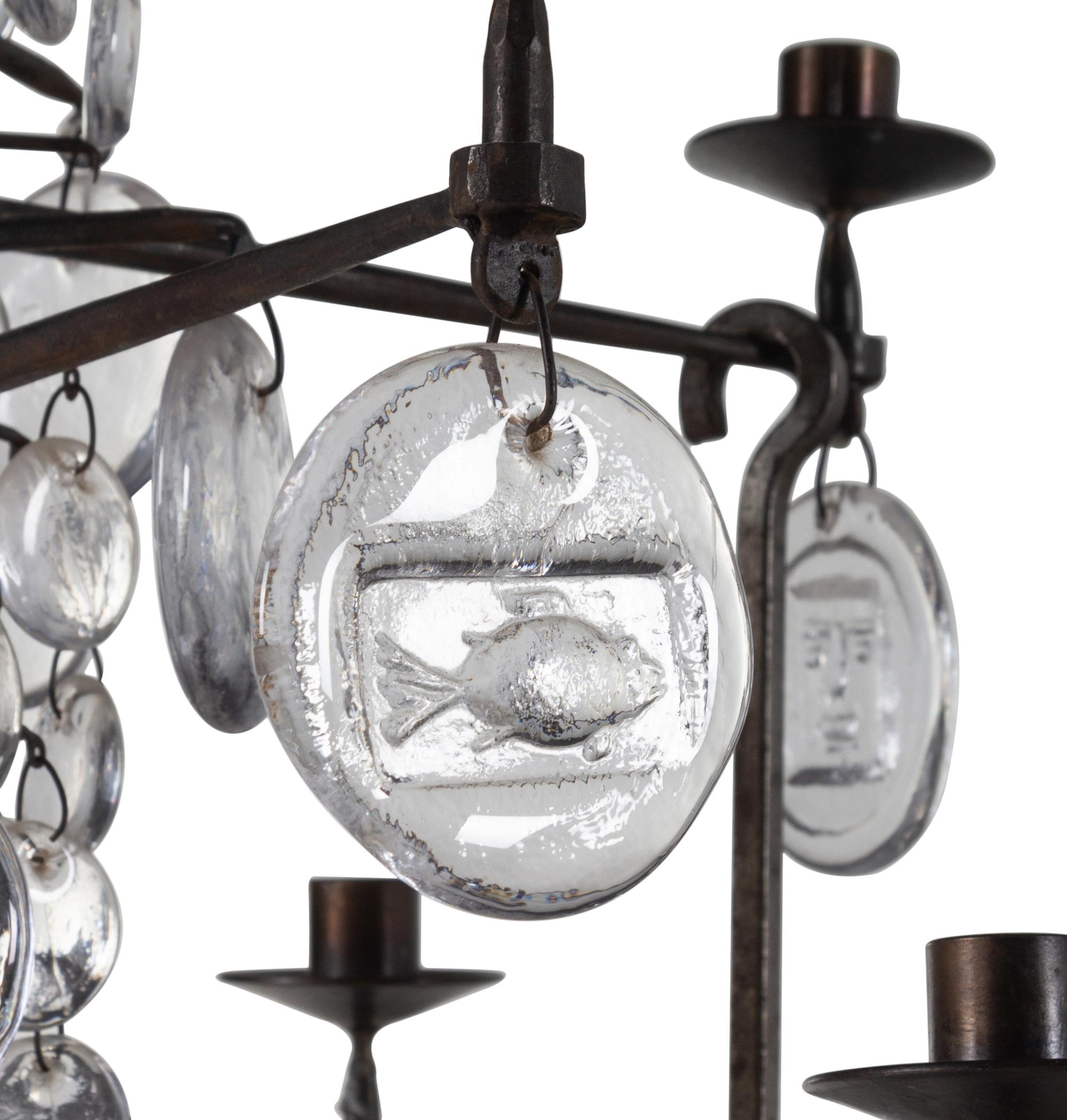A Swedish Wrought Iron and Molded Glass Twelve-Light Chandelier