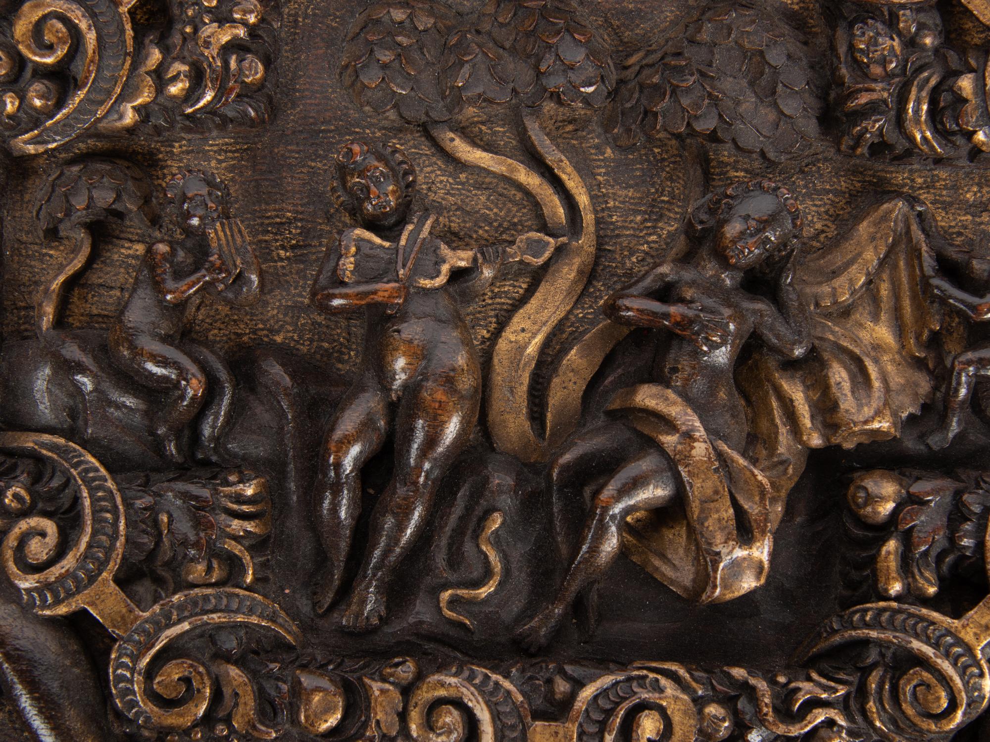 An Italian Parcel Gilt and Carved Walnut Orpheus and Eurydice Casket