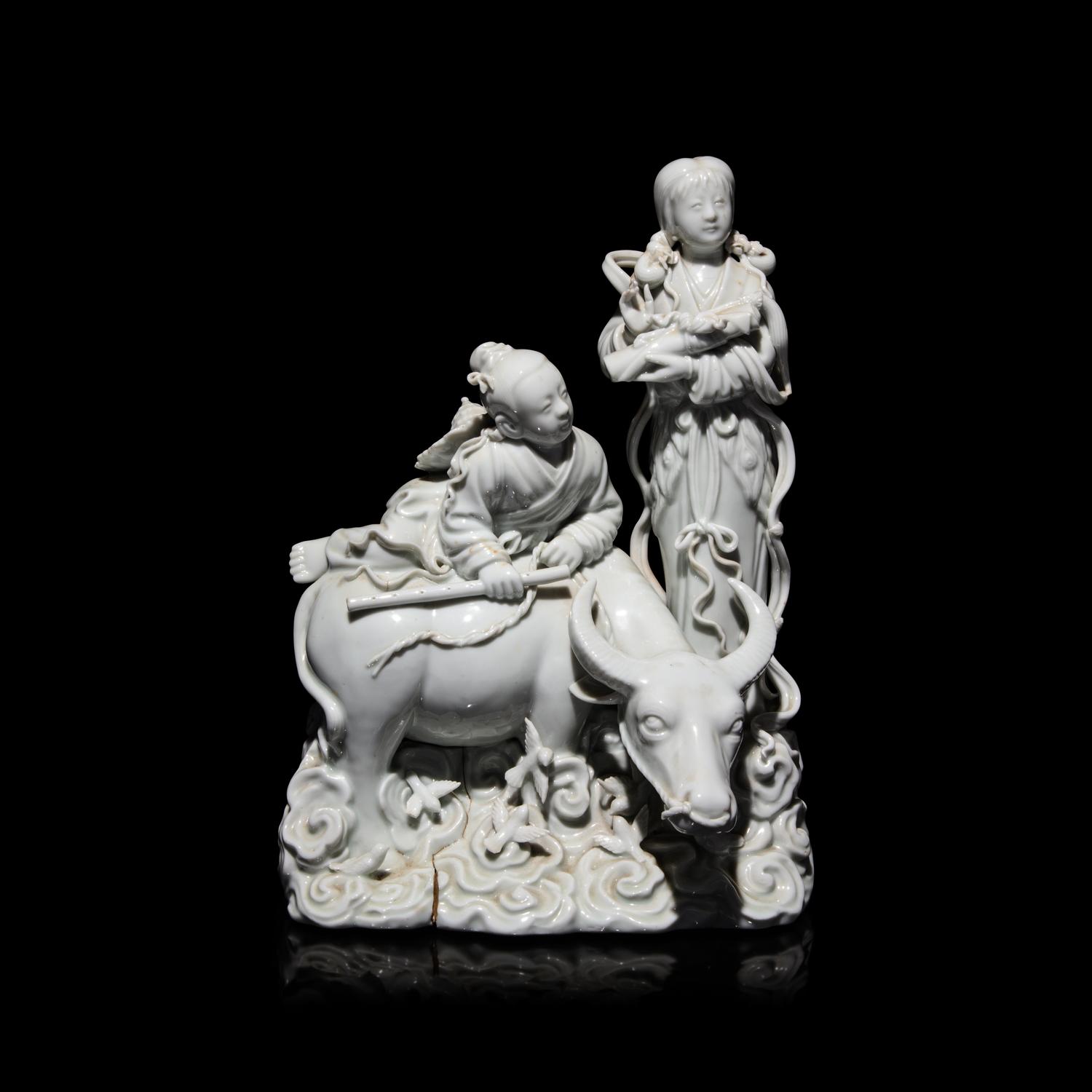 A Chinese Blanc de Chine Figural Group of the Weaver Girl and Herd Boy