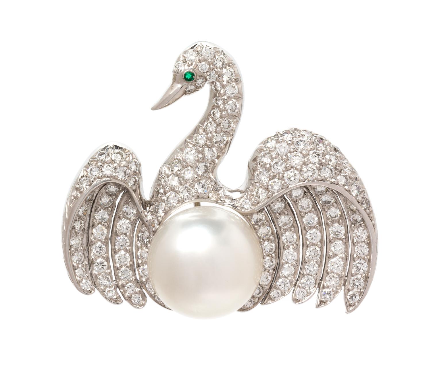 A Platinum, Cultured South Sea Pearl, Diamond and Emerald Swan Brooch, 11.55 dwts.